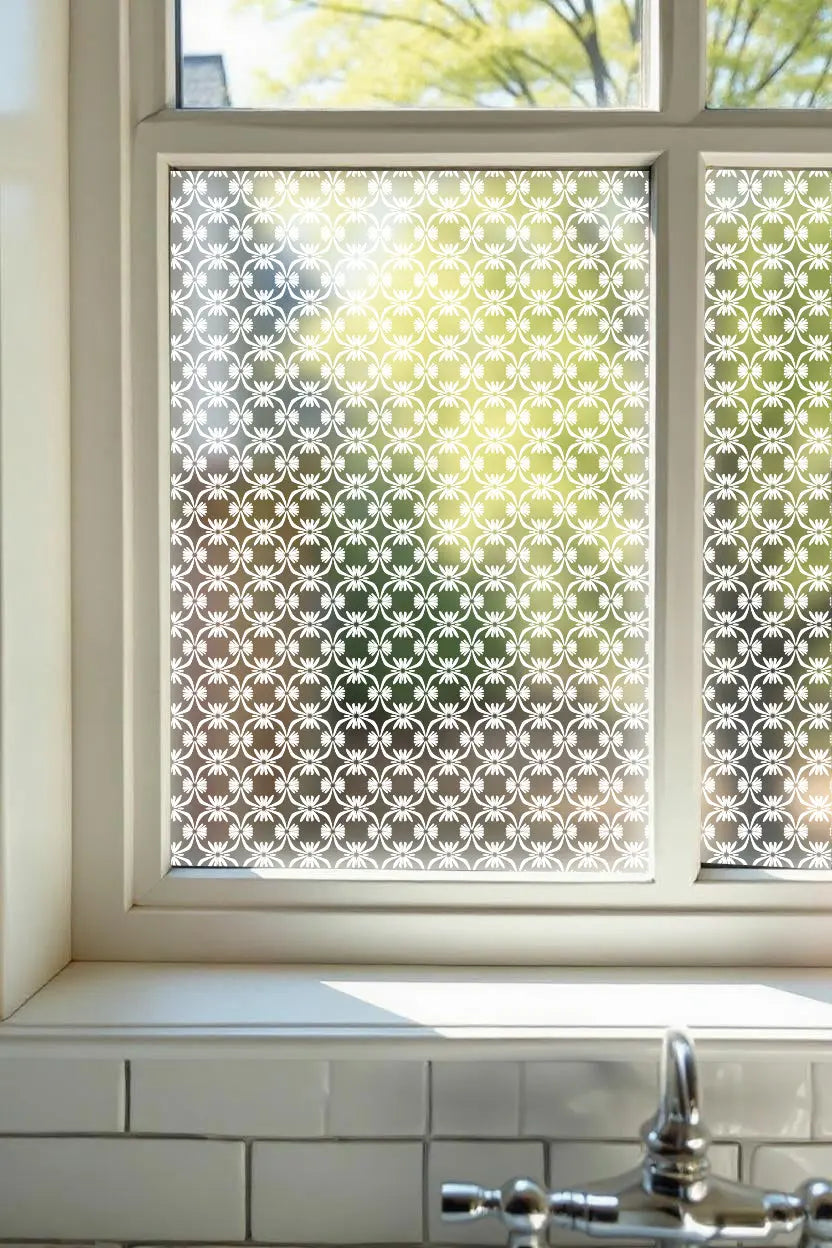 Geometric privacy window film with repeating decorative pattern