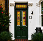 Art Deco stained glass window film for front doors with amber, red and green geometric panels and matching transom.